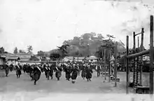 Image 5Japanese high-school girls playing football in their traditional hakama with one team wearing sashes (c. 1920) (from Women's association football)