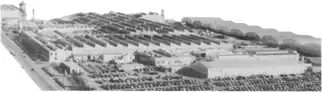 Photograph of a factory complex with lots of buildings