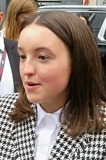 18 year-old girl talking to something to the left.