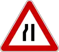 Road narrows on the left