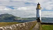 Image 27Rubha nan Gall lighthouse, Tobermory, Mull, built in 1857 by David and Thomas Stevenson, with a Caledonian MacBrayne ferry in the backgroundCredit: Colin