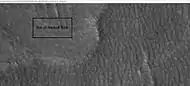 Patterned ground in Hellas, as seen by HiRISE under HiWish program. The rectangle shows the size of a football field.