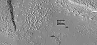 Arrows point to drumlin-like shapes that were probably formed under a glacier, as seen by HiRISE under HiWish program.