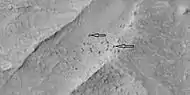 Blocks probably formed after fracturing in ridges, as seen by HiRISE under HiWish program