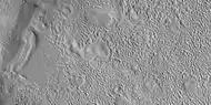 Close view of dipping layers, as seen by HiRISE under HiWish program. Brain terrain is also visible in the image.