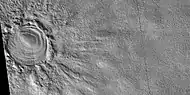 Close view of layered feature in crater, as seen by HiRISE under HiWish program.  Feature seems to be higher than parts of the crater rim.