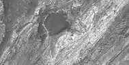 Close view of layers, as seen by HiRISE under HiWish program. Some layers are light-toned which means that they may have been associated with water.