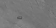 Close view of pits as seen by HiRISE under HiWish program. Box shows size of football field.  Pits in image may be around 10–20 meters across.
