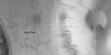 Close view of lava flow, as seen by HiRISE under HiWish program.  Dark slope streaks are also visible.