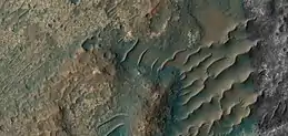 Close, color view of unusual TARs, as seen by HiRISE under HiWish program.  These features may have had variable local winds to make the wavy tops.