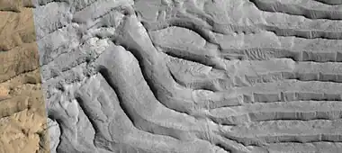 Faults in layers, as seen by HiRise under HiWish program  Image is about 1 km across.