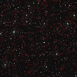 COSMOS field imaged by the Canada France Hawaii Telescope (CFHT). Red crosses mark some of the active galaxies with supermassive black holes at their centers.
