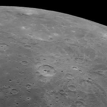 Oblique view of Carducci crater (below center) and Copley crater with bright rays