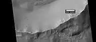 Mantle layers exposed on crater rim, as seen by HiRISE under HiWish program.  Mantle is an ice-rich material that fell from the sky when the climate underwent major changes.
