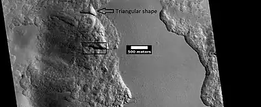 Close view from a previous image, as seen by HiRISE under HiWish program.  The triangular shape of some depressions are noted.  The area in the box is enlarged in following images.