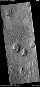 Wide view of ridges that are mostly curved.  Picture taken with HiRISE under HiWish program.