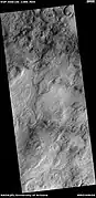 Concentric bands and layers that has been called "honeycomb terrain".  Picture was taken by HiRISE under the HiWish program.