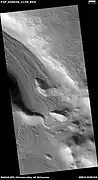 Valley showing Lineated valley fill, as seen by HiRISE under HiWish program.  Linear valley flow is caused by ice movements.