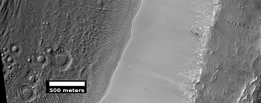 Possible pingos, as seen by HiRISE under HiWish program.  Pingos contain a core of ice.  They are expected to have cracks on their surfaces because water expands when it turns into ice.
