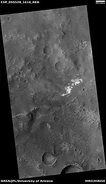 Contact showing light and dark-toned materials,  as seen by HiRISE under HiWish program. Light-toned materials typically contain water in minerals.