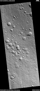 Possible expanded secondary craters, as seen by HiRISE under HiWish program.  These craters may have become much wider, as ice left the ground around the rims.