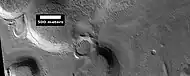 Mantle layers, as seen by HiRISE under HiWish program.  Mantle layers seem to be forming a group of dipping layers.