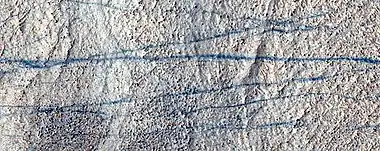 Close color view of dust devil tracks, as seen by HiRISE under HIWish program