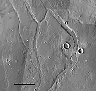 Middle portion of Enipeus Vallis. The valley divides into several channels, forming large central island at 37.0°N, 267.2°E. Image is THEMIS VIS mosaic.