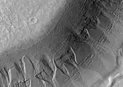 Gullies in the wall of Harmakhis, as seen by HiRISE.