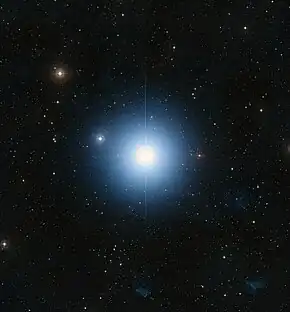 A large blue star in an ocean of other stars taken by telescope
