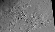 Surface features of Lycus Sulci, as seen by HiRISE under the HiWish program