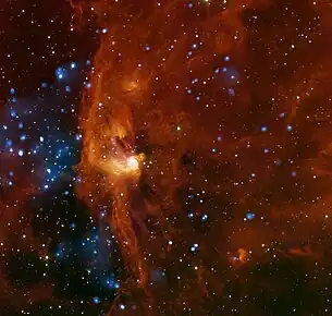 Composite of X-ray data from NASA's Chandra X-ray Observatory (blue) and infrared emission detected by NASA's Spitzer Space Telescope (red and orange)