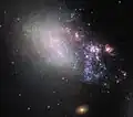 Interaction between them created a stream of material about 25 000 light-years long.