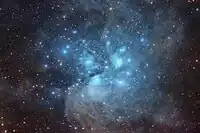 A widefield view of the Pleiades showing the surrounding dust.  Image taken with 56 hours of total exposure time.