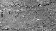 Dikes from when magma rises to near the surface in cracks in rocks. Later erosion may have exposed them