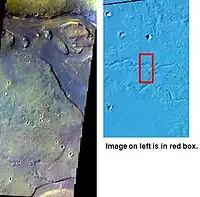 Tinjar Vallis, as seen by THEMIS. Color is enhanced to show differences.