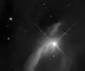 V883 Ori (bright star) and part of IC 429 with the Hubble Space Telescope