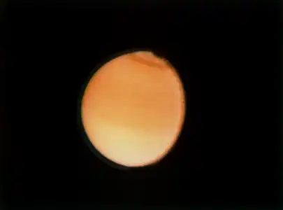 Another image of Titan taken by Voyager 2 on August 23, 1981, a few months after Voyager 1 arrived at Saturn first. The spacecraft was  around 2,300,000 kilometres or 1,400,000 miles away from the moon.