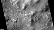 Layers just outside the rim of South crater in the form of "Swiss cheese", as seen by CTX camera (on Mars Reconnaissance Orbiter).  Note: this is an enlargement of a previous image of east side of South crater.