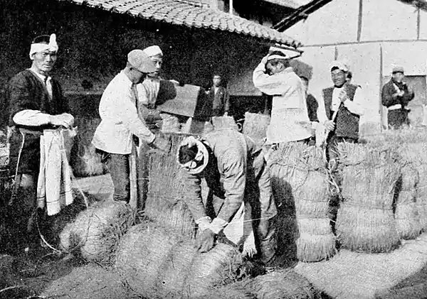 Farmers of forty centuries - Sacking rice in bags made from the rice straw, Japan.jpg