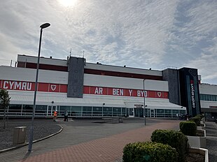Cardiff Airport - a white building with a red banner across the centre.