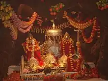The three icons representing the three aspects of the Mother Goddess in the Vaishno Devi temple shrine.