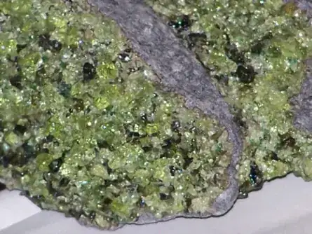 Image taken from https://en.wikipedia.org/wiki/File:Peridot_in_basalt.jpg. As per licensing conditions, credit goes to Wikimedia user Vsmith (https://commons.wikimedia.org/wiki/User:Vsmith)